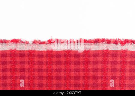 Woven cotton red color fabric on white background, Position with copy space. Stock Photo