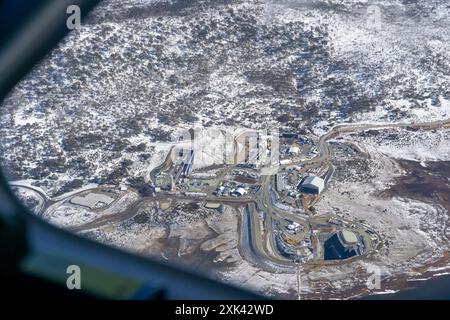 Tantangara Dam, Kosciuszko National Park New South Wales, Australia, 21tst July 2024; Aerial view of the Snowy 2.0 construction site at Tantangara dam, showing a light covering of snow and the tunnel entrance for the pumped hydro scheme. Progress of the tunnel boring machine has been reported  to have been delayed as a result of unstable geological formations. Credit PjHickox/Live News Alamy Stock Photo