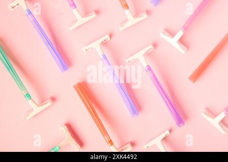 Different razors on pink background, closeup Stock Photo