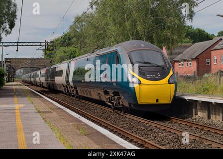 An Avanti West Coast class 390 Pendolino on a London to Manchester service passing through Chelford, Cheshire Stock Photo