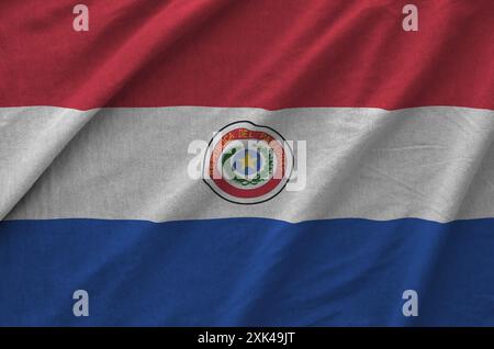 Paraguay flag depicted on folded wavy fabric of old cloth close up Stock Photo