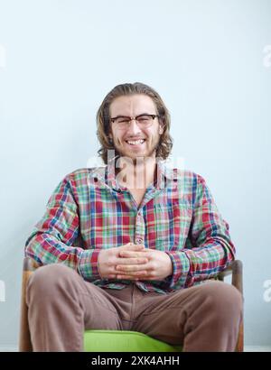 Creative, smile and man relax with portrait in office for tech support, system engineer and professional for business. Male IT specialist, pride and Stock Photo
