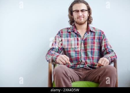 Creative, happy and man relax with portrait in office for tech support, system engineer and professional for business. Male it specialist, pride and Stock Photo