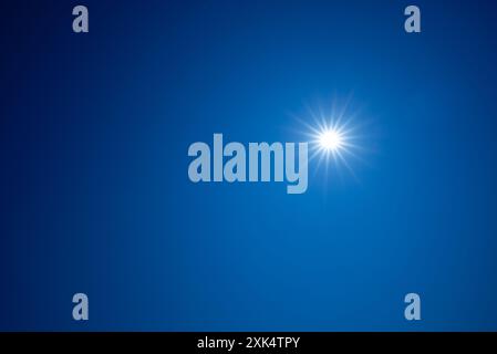 the sun high in the blue sky, noon Stock Photo