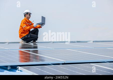 Professional Engineer Service Solar Panel. Worker Maintenance Cleaning Replacing Solar Panel. Solar photovoltaic panel system in Industry roof. Saving Stock Photo