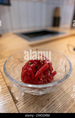 Yukhoe, a raw beef meat sliced and seasoned with salt, sugar, sesame oil, pepper, and garlic, etc. It is famous Korean food. Stock Photo