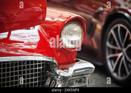 Red 1957 Ford Thunderbird Convertible with open hood at 2024 Doylestown at Dusk Car Show, Bucks County Pennsylvania, July 21, 2024. Stock Photo