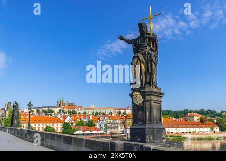 Historic Charles Bridge (Karlův most) is a medieval stone arch bridge over the Vltava river that connects the Old Town with Prague Castle. Prague, Cze Stock Photo