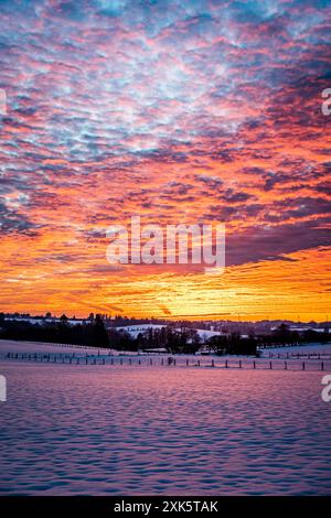 Sunset over fields in winter Stock Photo