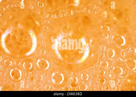 Bubbles in peach color 2024. Beautiful attractive background. Ultra macro photography Stock Photo