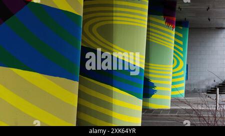 Dundee, Scotland – March 24 2024:The pillars in an underpass, painted in psychedelic colours and effects Stock Photo