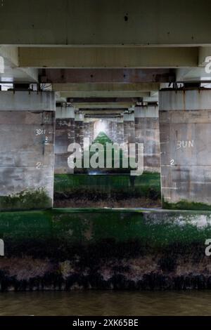 Dundee, Scotland – March 24 2024:The Concrete supports of the Tay road bridge resting on the caissons in the River Tay, with visible high flood marks. Stock Photo