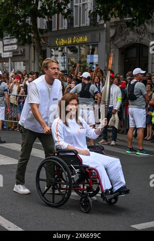 Lebanese photojournalist Christina Assi carries the Olympic torch, to ...