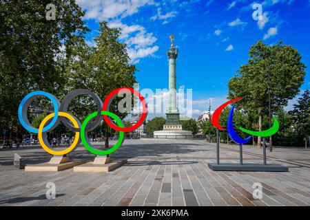 Paris, France - 07 20 2024: Olympic Games Paris 2024. View of the Bastille's Place with the July Column, the Paralympic Flames and the Olympic Rings Stock Photo