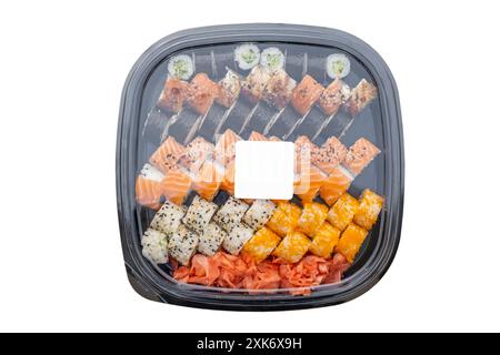 Plastic box with a set of sushi and a blank label on top for company logo or text, isolated table top view Stock Photo
