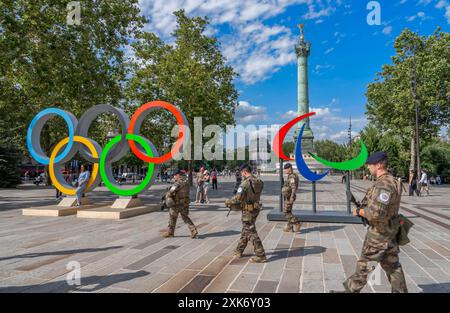 Paris, France - 07 20 2024: Olympic Games Paris 2024. View of the Bastille's Place with the July Column, the Paralympic Flames, the Olympic Rings and Stock Photo