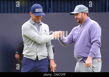 USA's Billy Horschel (left) and South Africa's Thriston Lawrence fist bump after their rounds during day four of The Open at Royal Troon, South Ayrshire, Scotland. Picture date: Sunday July 21, 2024. Stock Photo