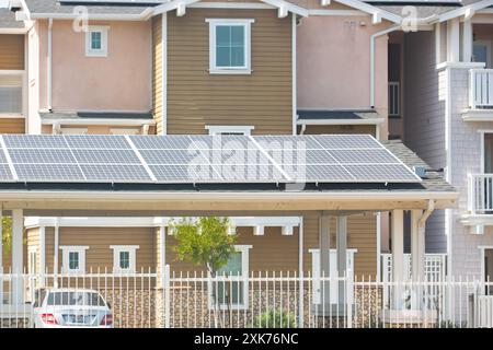 Los Angeles, California, United States - 04-07-2021: A view of solar panels installed above a car port structure in a condominium complex. Stock Photo