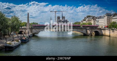 Paris, France - 07 20 2024: Olympic Games Paris 2024. View the quayside of the Seine with the estrades on Tournelle Bridge, in front of the Notre-Dame Stock Photo