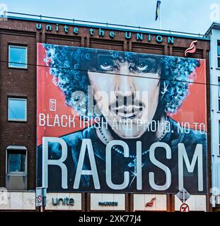 A large mural with the message Black Irish and Proud. No to Racism on the offices of Unite Trade Union in Dublin, Ireland. Stock Photo