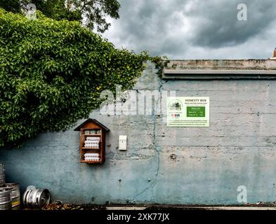 Diffley Farm eggs for sale along the side of a road, accompanied by an honesty box in Tarmonbarry, ireland. Stock Photo