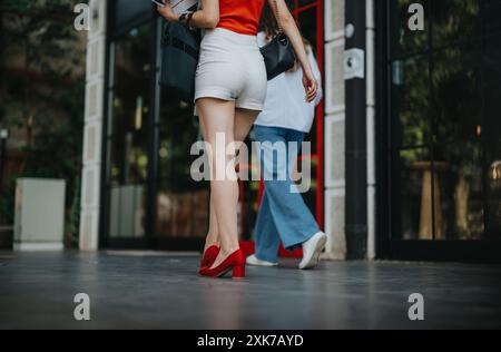 Businesswomen walking outdoors in casual attire during meeting Stock Photo