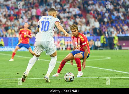 Kylian MBAPPE, FRA 10  compete for the ball, tackling, duel, header, zweikampf, action, fight against Lamine Yamal, ESP 19  in the semi final match  SPAIN - FRANCE 2-1 of the UEFA European Championships 2024  on Jul 9, 2024  in Munich, Germany.  Photographer: Peter Schatz Stock Photo