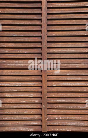 Window with wooden shutters, wooden blinds. Wood texture, wood background Stock Photo