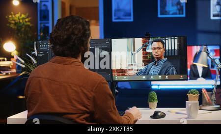 Remotely working software developer talking with manager during online videocall, updating him on programming task progress. IT specialist in teleconference meeting with team leader, camera A Stock Photo