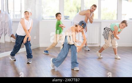 Tween girl mastering krump dance in children dance studio Stock Photo