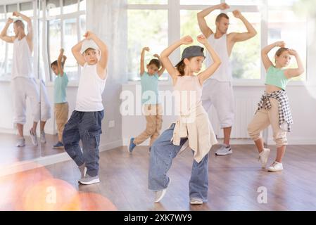 Tween girl mastering krump dance in children dance studio Stock Photo