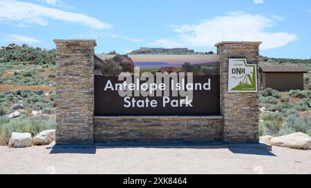 Syracuse, UT, USA - June 10, 2024; Stone sign for Antelope Island State Park on Great Salt Lake Stock Photo