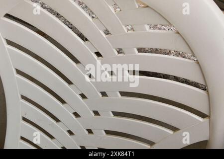Back of white plastic pvc chair close-up. Background. Texture. Stock Photo