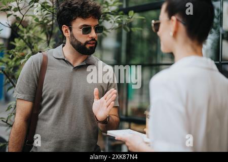 Outdoor meeting between business people discussing work in a natural setting Stock Photo