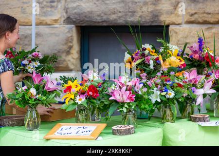 Let Me Sow Love flower arrangements on display at the YLNI Farmers Market in Fort Wayne, Indiana, USA. Stock Photo