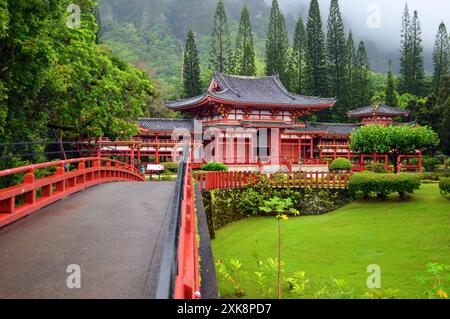 AS Buddhist temple is nestled in a fog shrouded valley Stock Photo