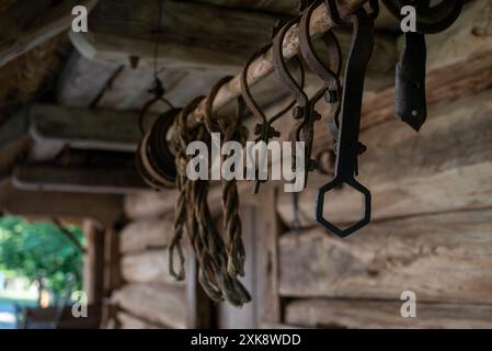 old simple tools outside an antique stable in the countryside Stock Photo