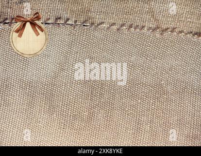 Two pieces of old burlap sewn together with thread. Horizontal background with rustic bag texture Stock Photo
