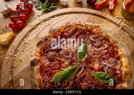 Details of fresh baked tasty Italian pizza on wooden board Stock Photo