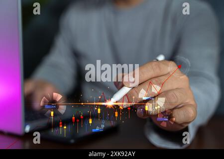 Businessman pointing finger to stock market finance graph chart exchange money or growth investment global economy analysis rate on economic technolog Stock Photo