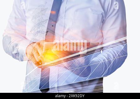 Create a clean electric power business investment concept. Businessman holding tablet calculating investment cost of electricity solar panel backgroun Stock Photo