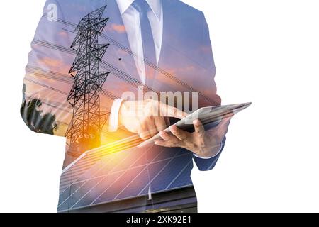 Create a clean electric power business investment concept. Businessman holding tablet calculating investment cost of electricity solar panel backgroun Stock Photo