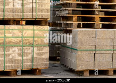 Stone slabs for road repairs stacked on a wooden pallet. Stock Photo