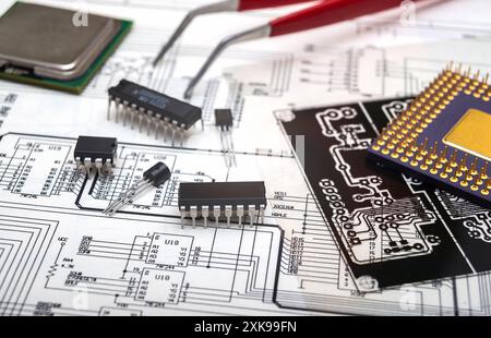 Electronic components and tools on an engineering blueprint for circuit board design. Stock Photo