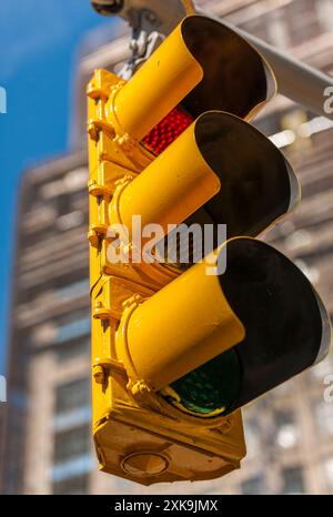 American Traffic Lights above a busy  intersection in New York city - USA Stock Photo