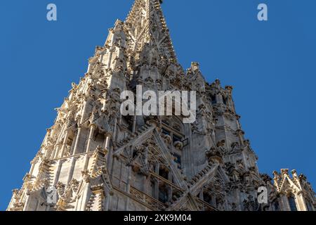 Wien, Austria - October 28, 2023 : Detailed stone spire against a blue sky in Vienna, Austria. Stock Photo