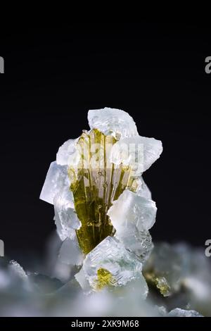 green Epidote with clear Prehnite. macro photography detail texture. Specimen from Arvigo, Switzerland. close-up polished semi-precious gemstone. Stock Photo