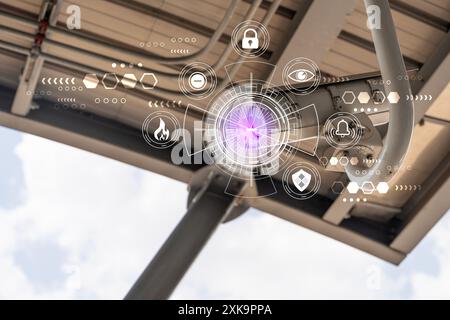 Modern CCTV on foggy day wall in city background with abstract infographics. Outdoor Security camera. CCTV, secure, monitoring concept. Stock Photo