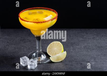 Fresh mango cocktail. Mexican mango cocktail on black slate background Stock Photo