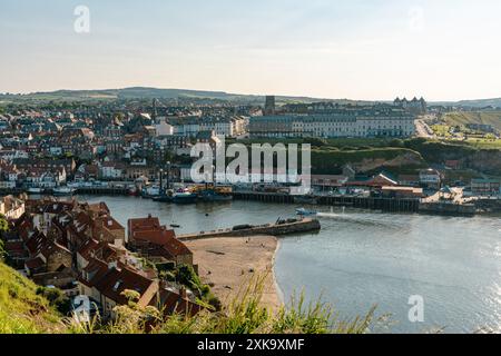 Whitby, North Yorkshire, England, UK - June 21, 2023: View from the East cliff to the West cliff Stock Photo